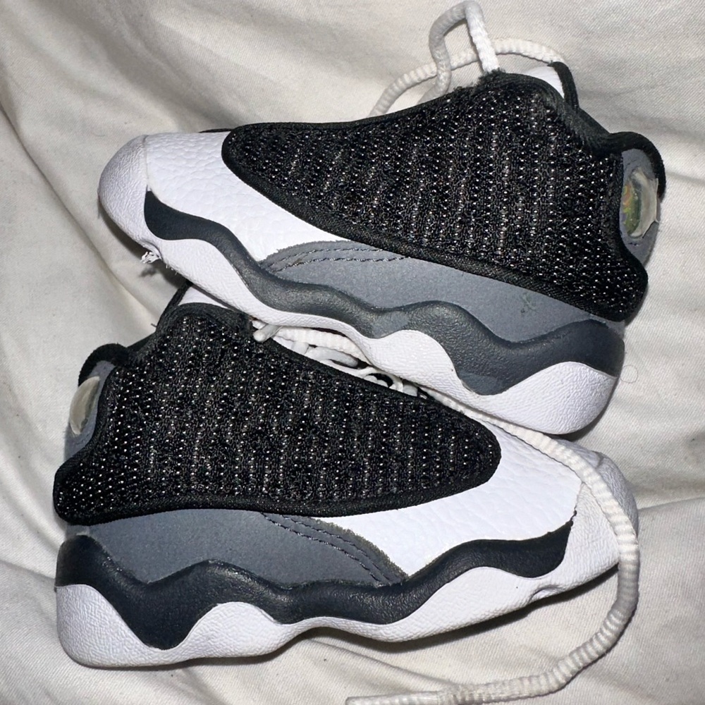 JORDAN 13 RETRO (TD)

BLACK/UNIVERSITY RED
NOIR/UNIVERSITE ROUGE